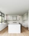 Kitchen featuring light wood-style flooring, light stone counters, white cabinetry, a kitchen island, and recessed lighting