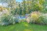 View of yard with a fenced in pool