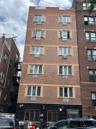 View of apartment building / complex with cooling unit