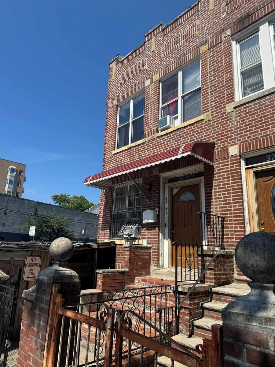 View of front of house with brick siding