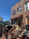 View of front of house with brick siding