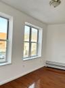 Spare room with wood finished floors and baseboards