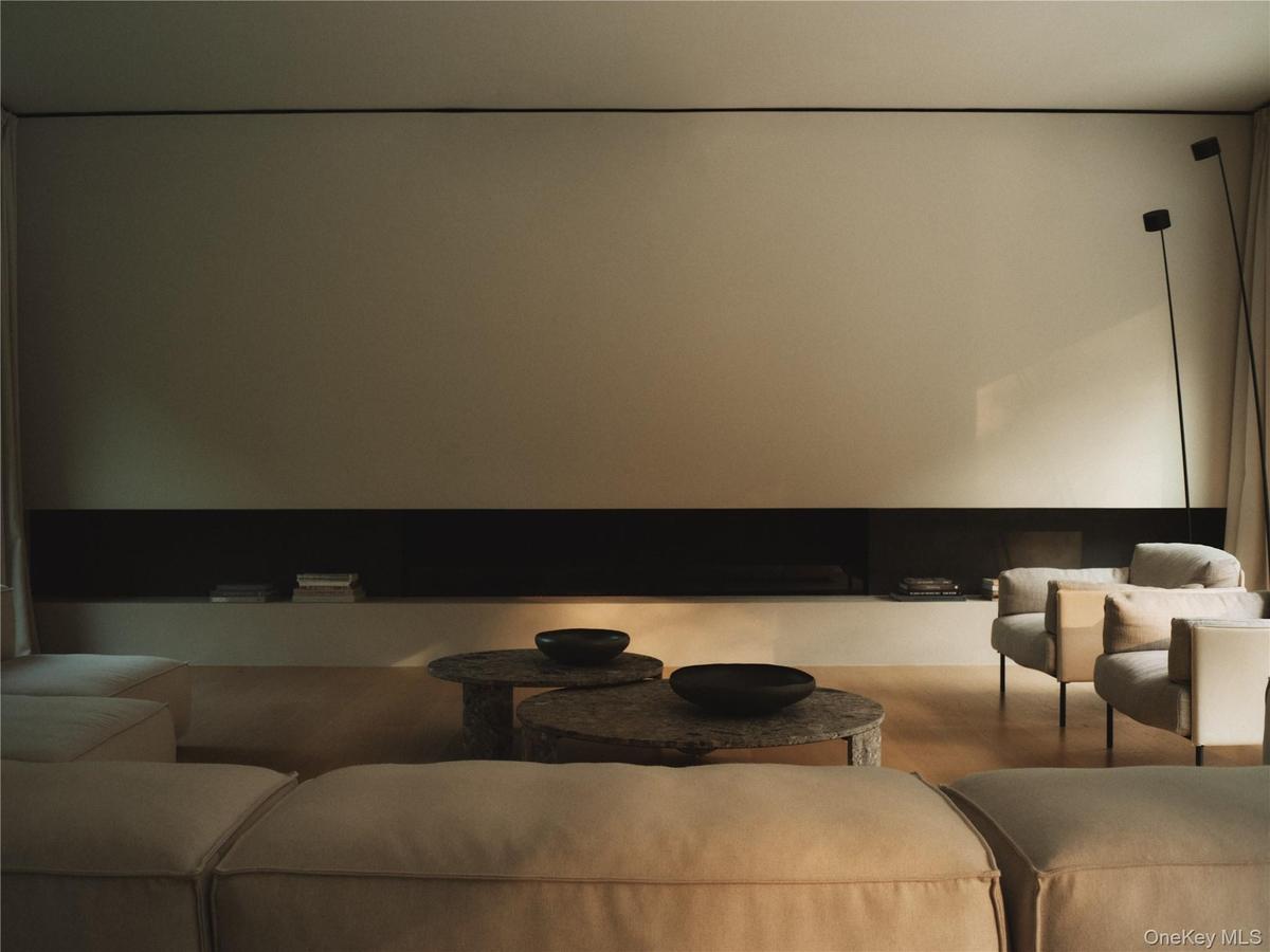 Living Room with Ethanol 9' long Fireplace and micro-cement harth