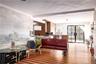 Living room featuring crown molding and wood-type flooring