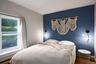 Bedroom featuring wood finished floors and baseboard heating