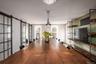 Dining room featuring a barn door and baseboards