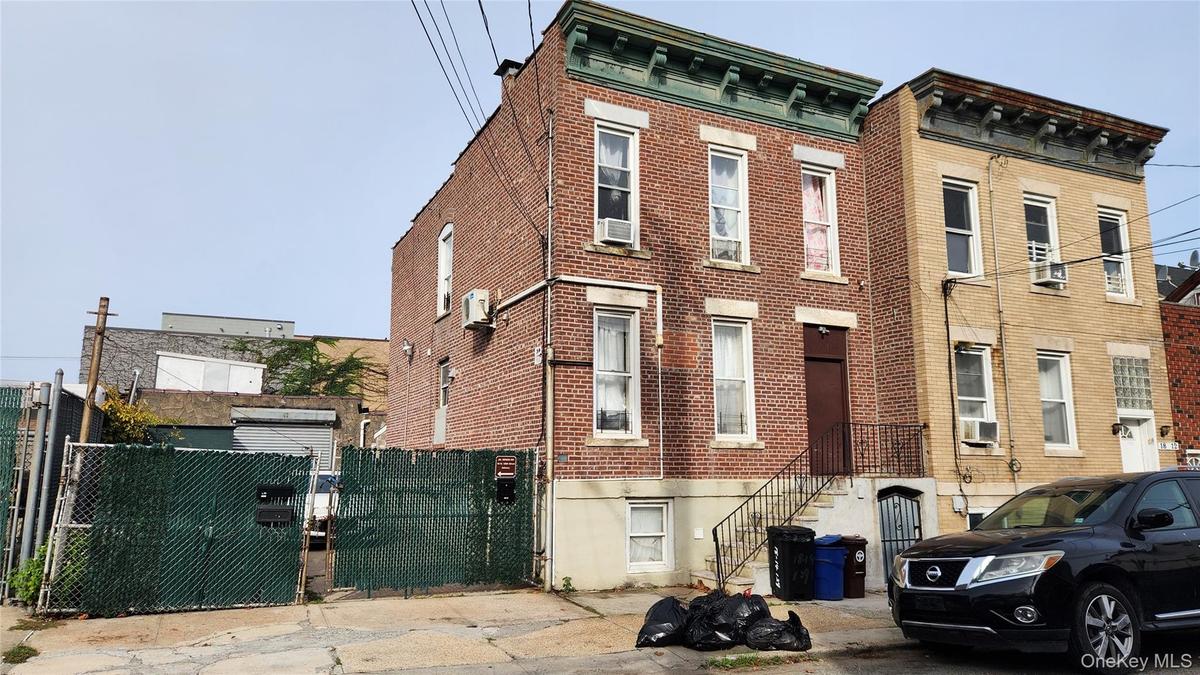 View of property featuring stairs