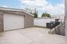 Garage featuring concrete driveway