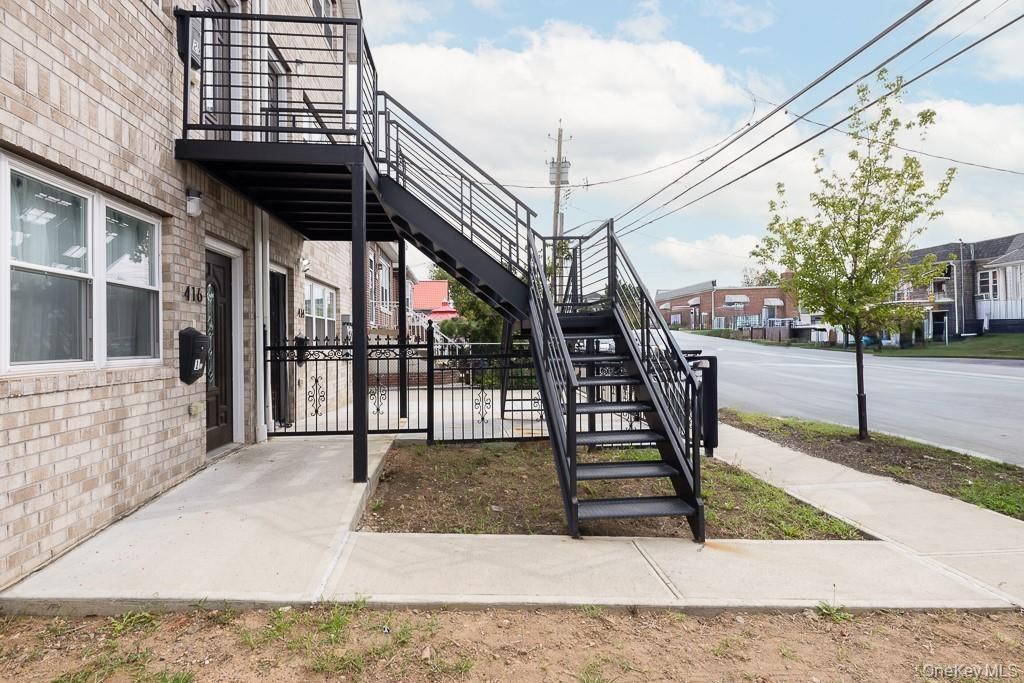 View of patio with stairs and a residential view