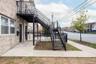 View of patio with stairs and a residential view