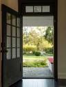 Doorway featuring tile patterned flooring and healthy amount of natural light