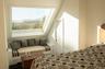 Bedroom featuring a skylight and multiple windows