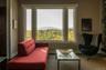 Living area featuring plenty of natural light and a mountain view