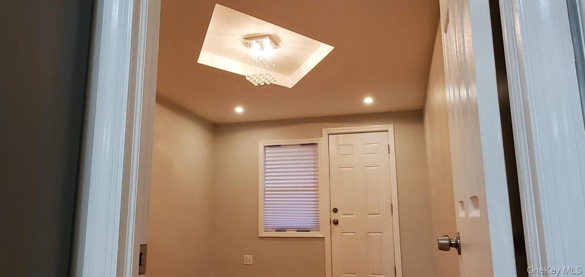 Detailed view of recessed lighting and a skylight