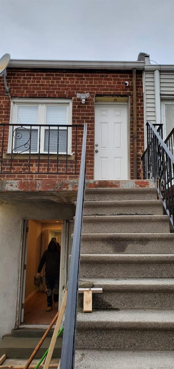 Doorway to property with brick siding