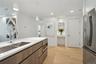 Kitchen featuring decorative light fixtures, stainless steel appliances, light hardwood / wood-style floors, and sink