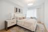 Bedroom with light hardwood / wood-style flooring