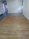 Spare room with dark wood-style floors