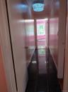Corridor featuring crown molding and granite floors