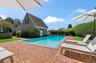 View of swimming pool featuring a fenced backyard and a patio