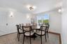 Dining area with baseboards and dark wood finished floors