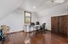 Office area featuring hardwood / wood-style flooring, lofted ceiling, a ceiling fan, and recessed lighting