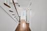 Entryway with stairway and dark wood-style flooring