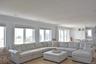 Living room featuring light hardwood / wood-style flooring, a wealth of natural light, and ornamental molding
