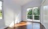 Spare room with lofted ceiling and wood finished floors