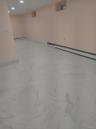 Spare room with light marble finish floors, a baseboard heating unit, and recessed lighting