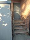 Property entrance with brick siding