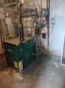 Utility room with a heating unit and water heater