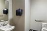 Half bath featuring toilet and a sink