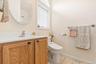 Bathroom featuring vanity, toilet, and tile patterned floors