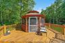 Wooden terrace featuring a gazebo