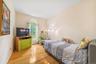 Bedroom with wood-type flooring
