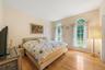 Bedroom with light hardwood / wood-style flooring
