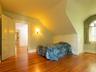 Bedroom featuring wood finished floors and lofted ceiling