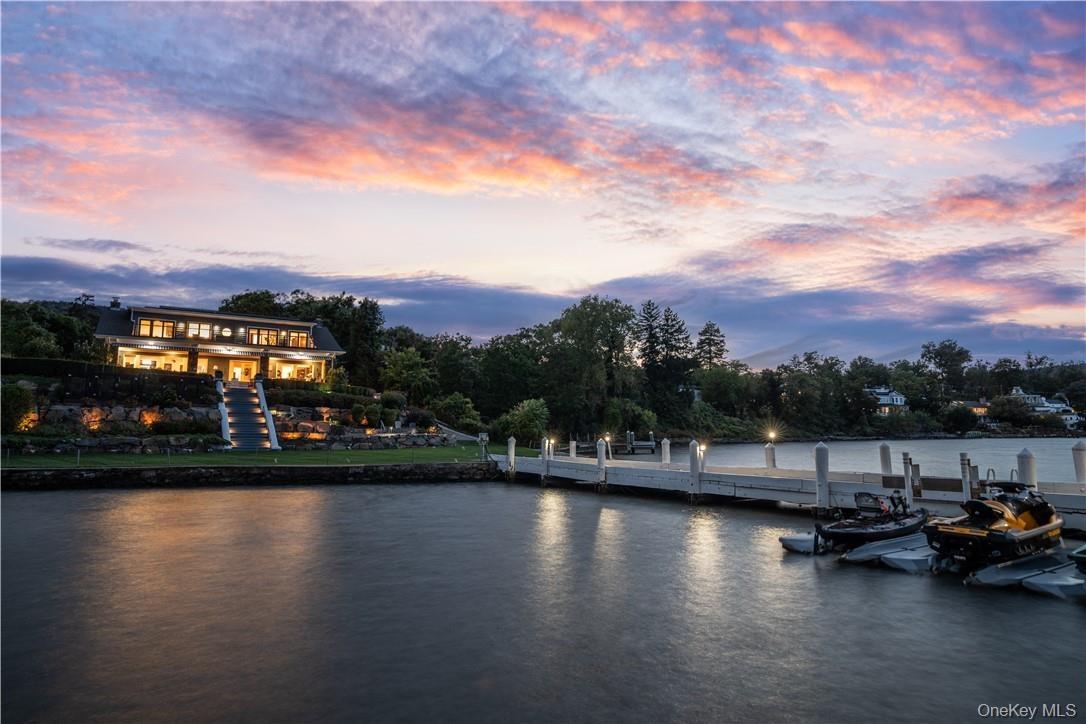 Property view of water with a boat dock