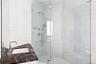 Full bath with a stall shower and vanity