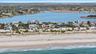 Bird's eye view featuring a water view and a view of the beach
