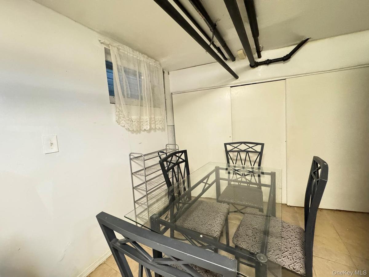 Dining space featuring light tile patterned floors