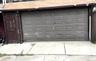 Garage featuring driveway