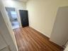 Hall featuring wood finished floors and baseboards