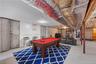 Rec room featuring billiards table, concrete floors, heating fuel, and water heater