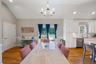 Dining room with recessed lighting, light wood finished floors, lofted ceiling, and a chandelier