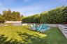 Fenced backyard featuring a patio and an outdoor fire pit