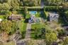 Aerial overview of property's location with a pool area