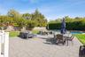 Fenced backyard with an outdoor living space, a patio, and outdoor dining area