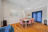 Dining area with light wood-style flooring, a chandelier, recessed lighting, and high vaulted ceiling